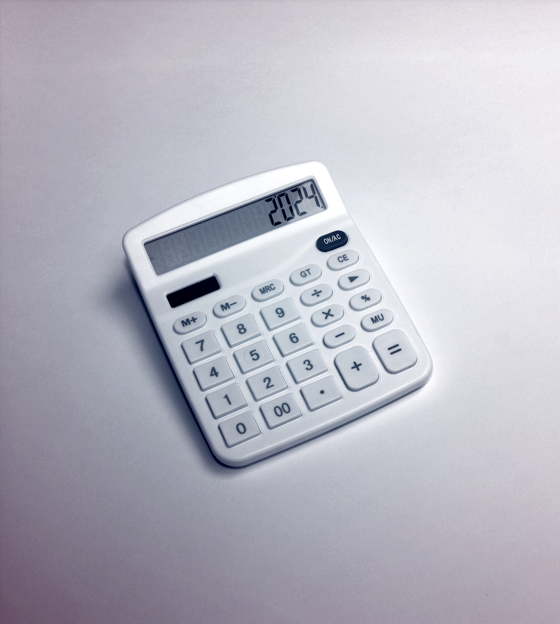 a white calculator sitting on top of a table